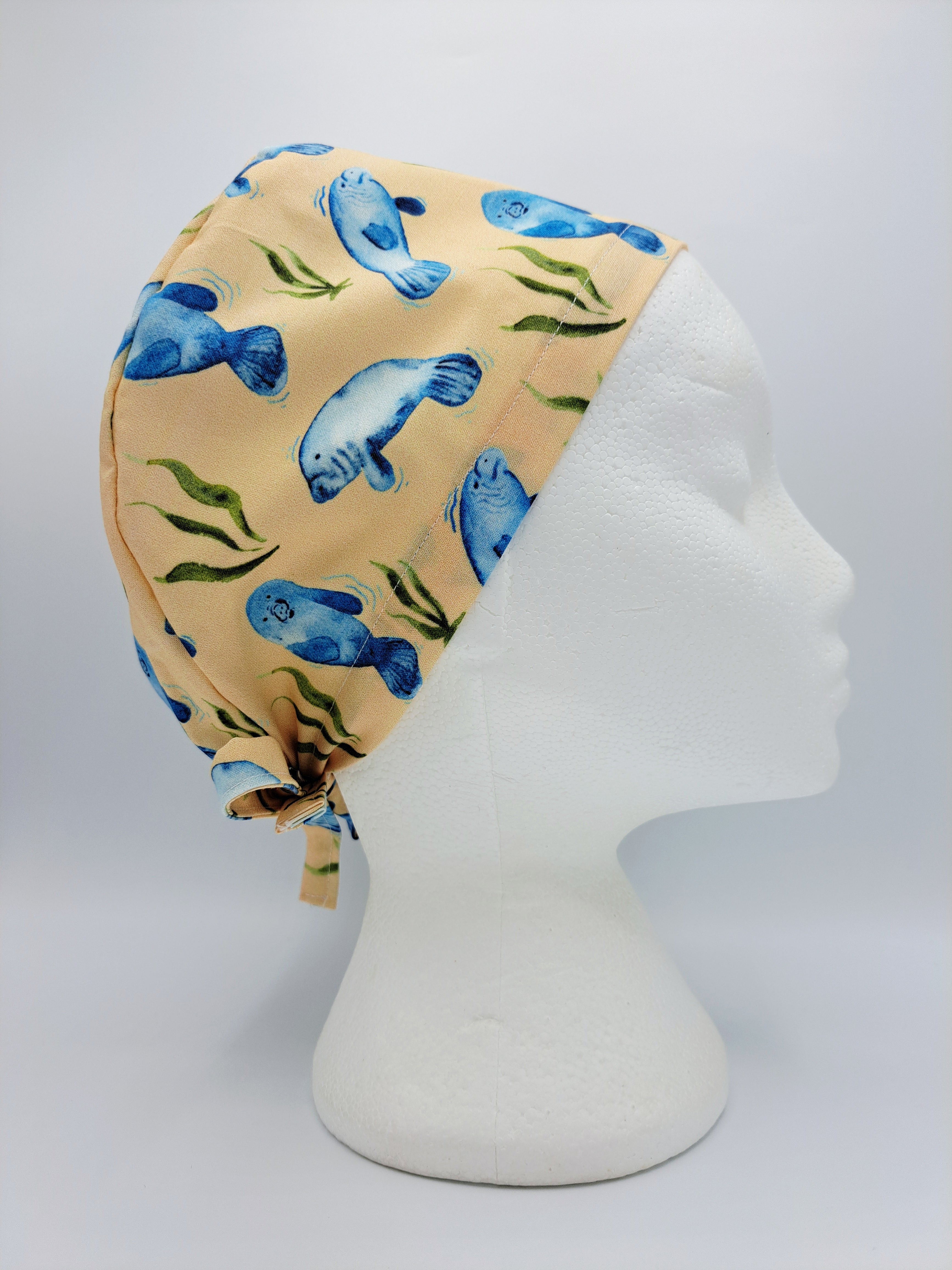 Manatees on Peach Scrub Hat Cap